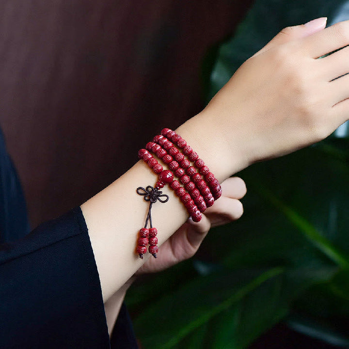 Cinnabar Om Mani Padme Hum Pattern Engraved 108-Bead Mala Bracelet — product view 6