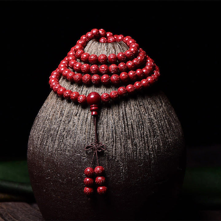 Cinnabar Om Mani Padme Hum Pattern Engraved 108-Bead Mala Bracelet — product view 8