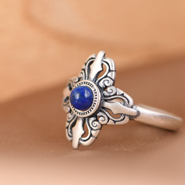 Adjustable sterling silver ring with deep blue lapis lazuli stone