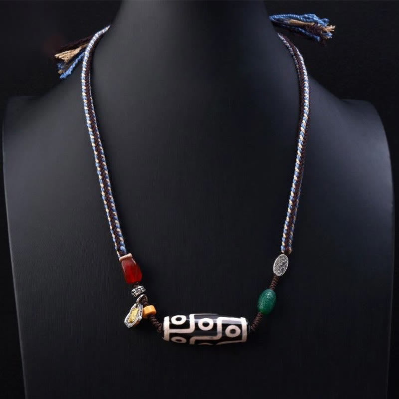 Tibetan nine-eye Dzi bead cord pendant — view 2