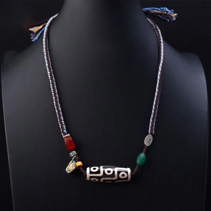 Tibetan nine-eye Dzi bead cord pendant — view 2