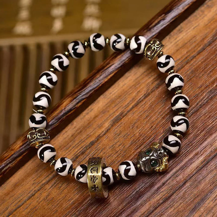 Dzi bead and copper mantra bracelet — view 1
