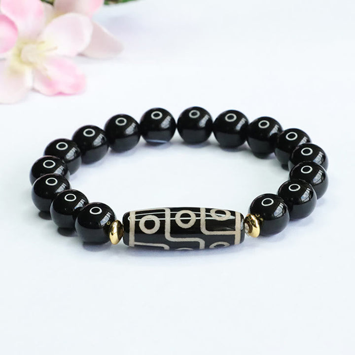 Tibetan Nine-Eye Dzi Bead and Black Onyx Bracelet — view 1