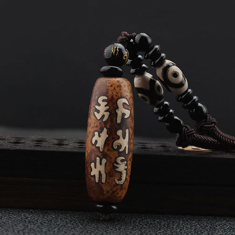 Tibetan Dzi bead Avalokiteshvara pendant — view 1
