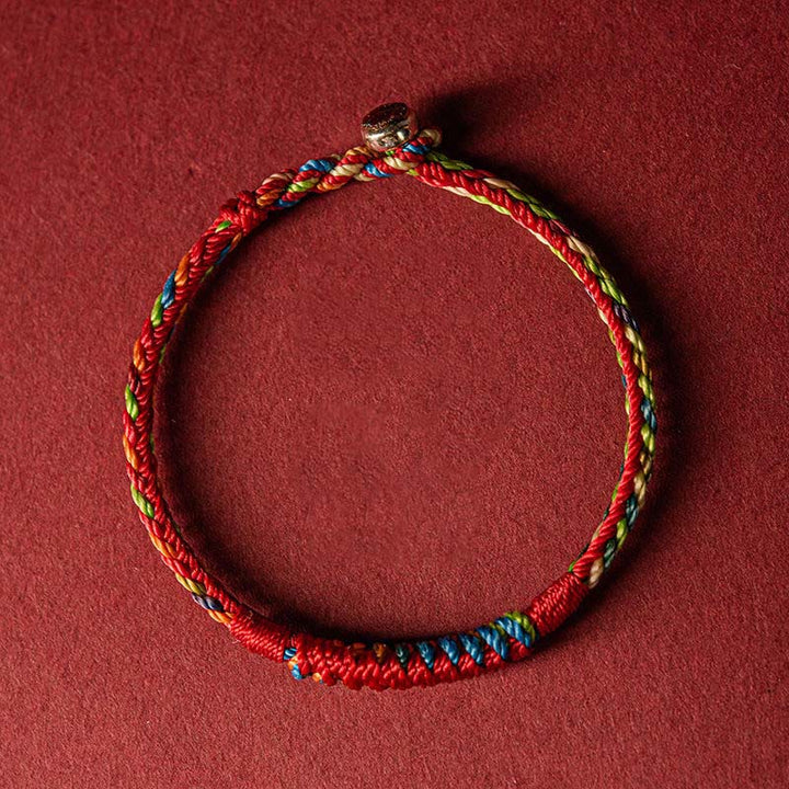 Close-up of handwoven five-color bracelet strands