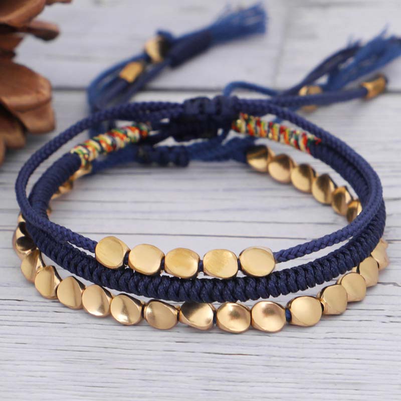 Three-piece copper bead cord bracelet set — view 1