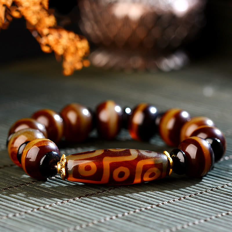 Nine-Eye Dzi bead and agate bracelet — view 1