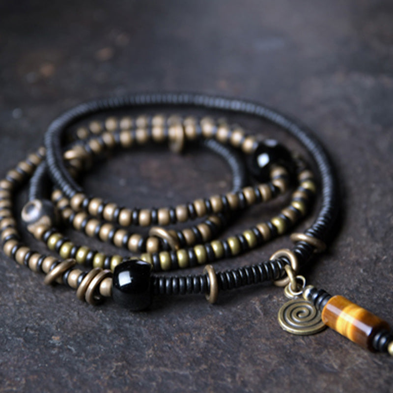 Ebony wood Dzi bead and copper bracelet — view 1
