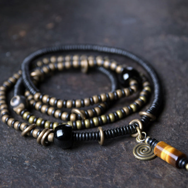 Ebony wood Dzi bead and copper bracelet — view 1