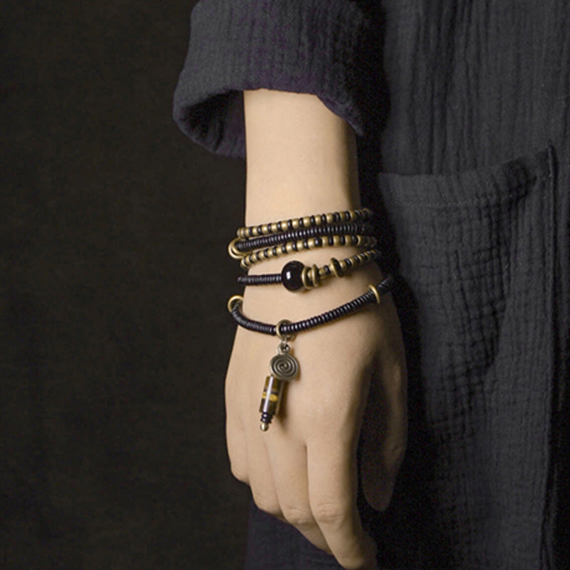 Ebony wood Dzi bead and copper bracelet — view 4