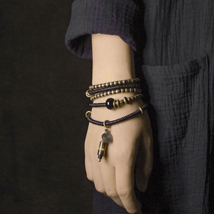 Ebony wood Dzi bead and copper bracelet — view 4