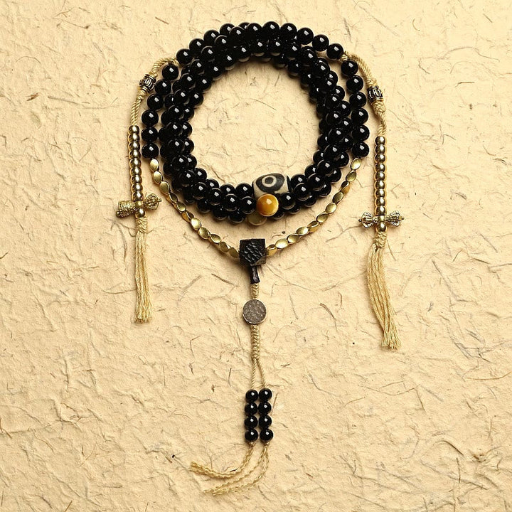 Tibetan Black Onyx Three-Eyed Dzi Beads 108-Bead Mala Bracelet — main product view