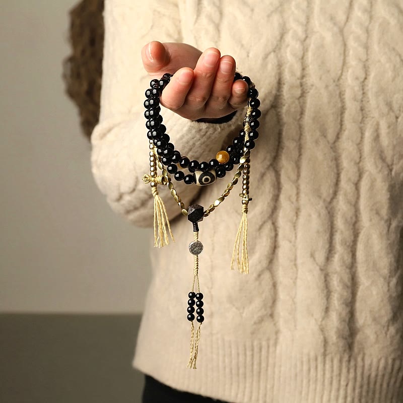 Tibetan Black Onyx Three-Eyed Dzi Beads 108-Bead Mala Bracelet — product view 2
