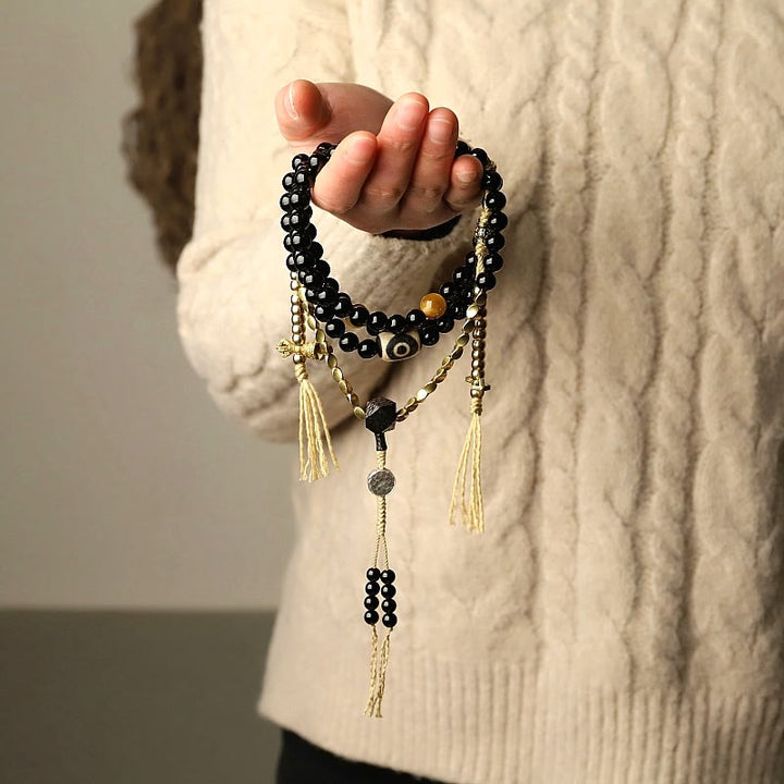 Tibetan Black Onyx Three-Eyed Dzi Beads 108-Bead Mala Bracelet — product view 2