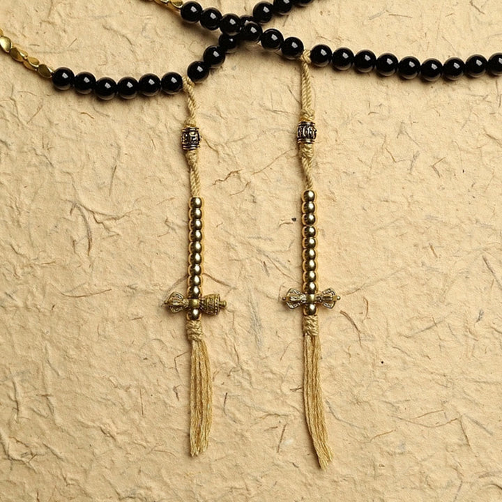 Tibetan Black Onyx Three-Eyed Dzi Beads 108-Bead Mala Bracelet — product view 6