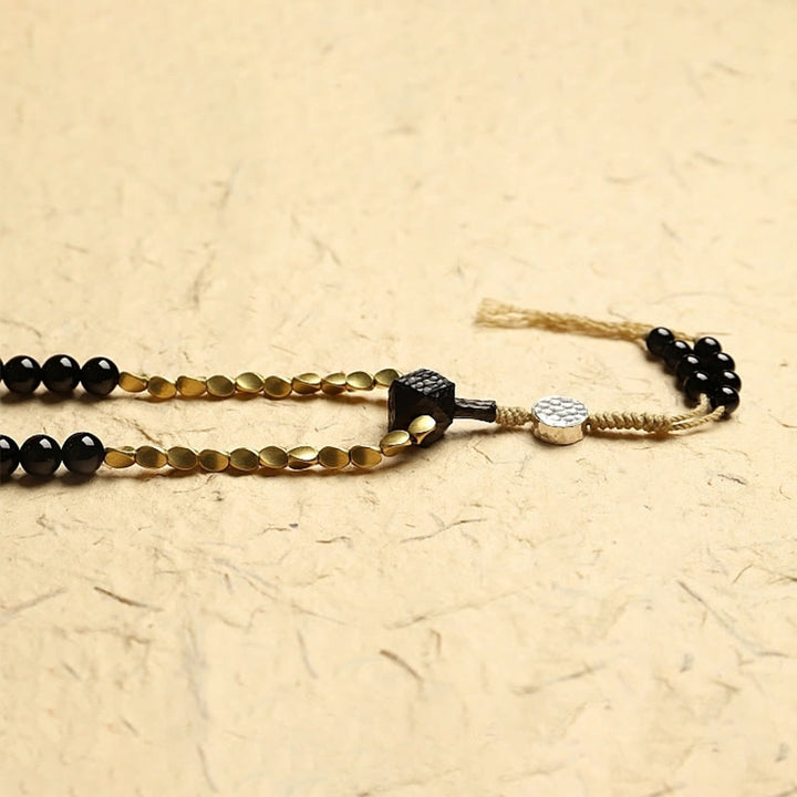 Tibetan Black Onyx Three-Eyed Dzi Beads 108-Bead Mala Bracelet — product view 8