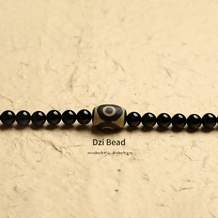 Tibetan Black Onyx Three-Eyed Dzi Beads 108-Bead Mala Bracelet — product view 15